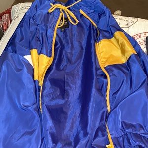 urban retro blue, white, and yellow sweater